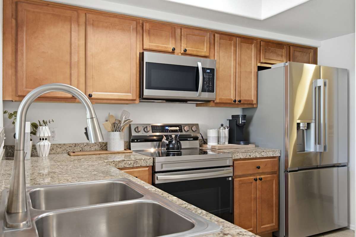 Cook up a feast in the well-appointed kitchen, featuring granite counters, stainless appliances, and a Keurig for easy mornings.