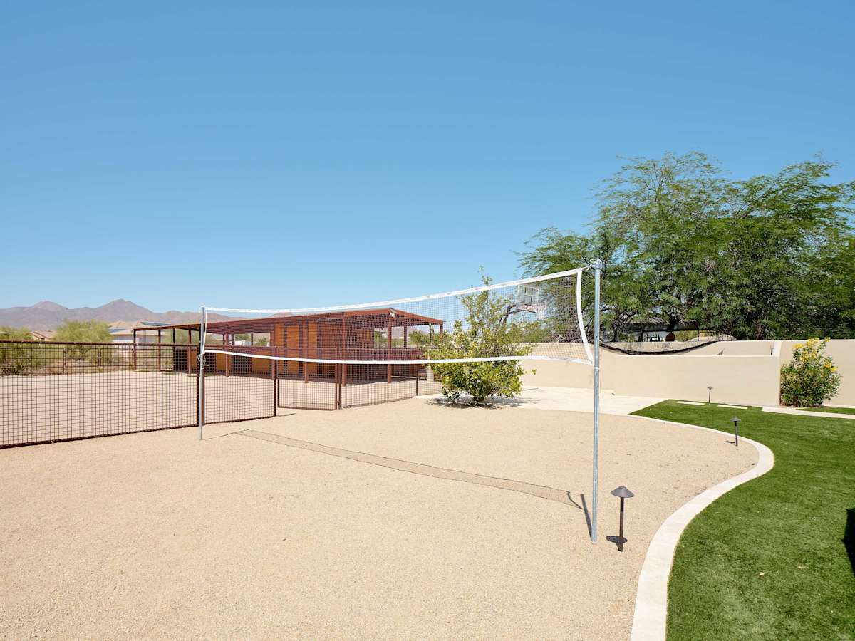 Private backyard with a sparkling pool and hot tub, BBQ grill, plus fun amenities including tetherball, volleyball, basketball, a horse stable with swings, mini golf, and darts.