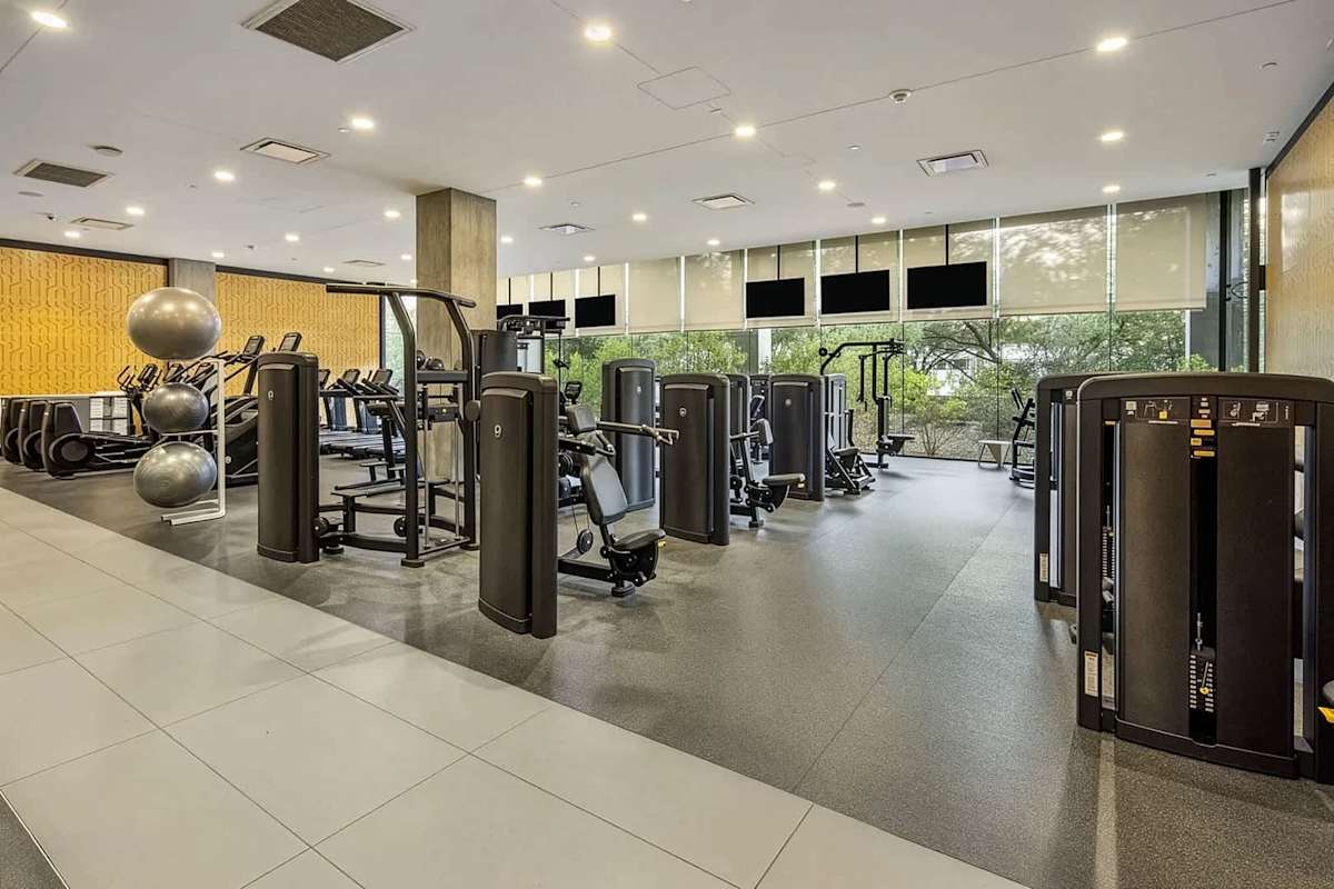 Communal Area: Gym, yoga studio, basketball court, and golf simulator, offering a wide range of workout equipment and entertainment options