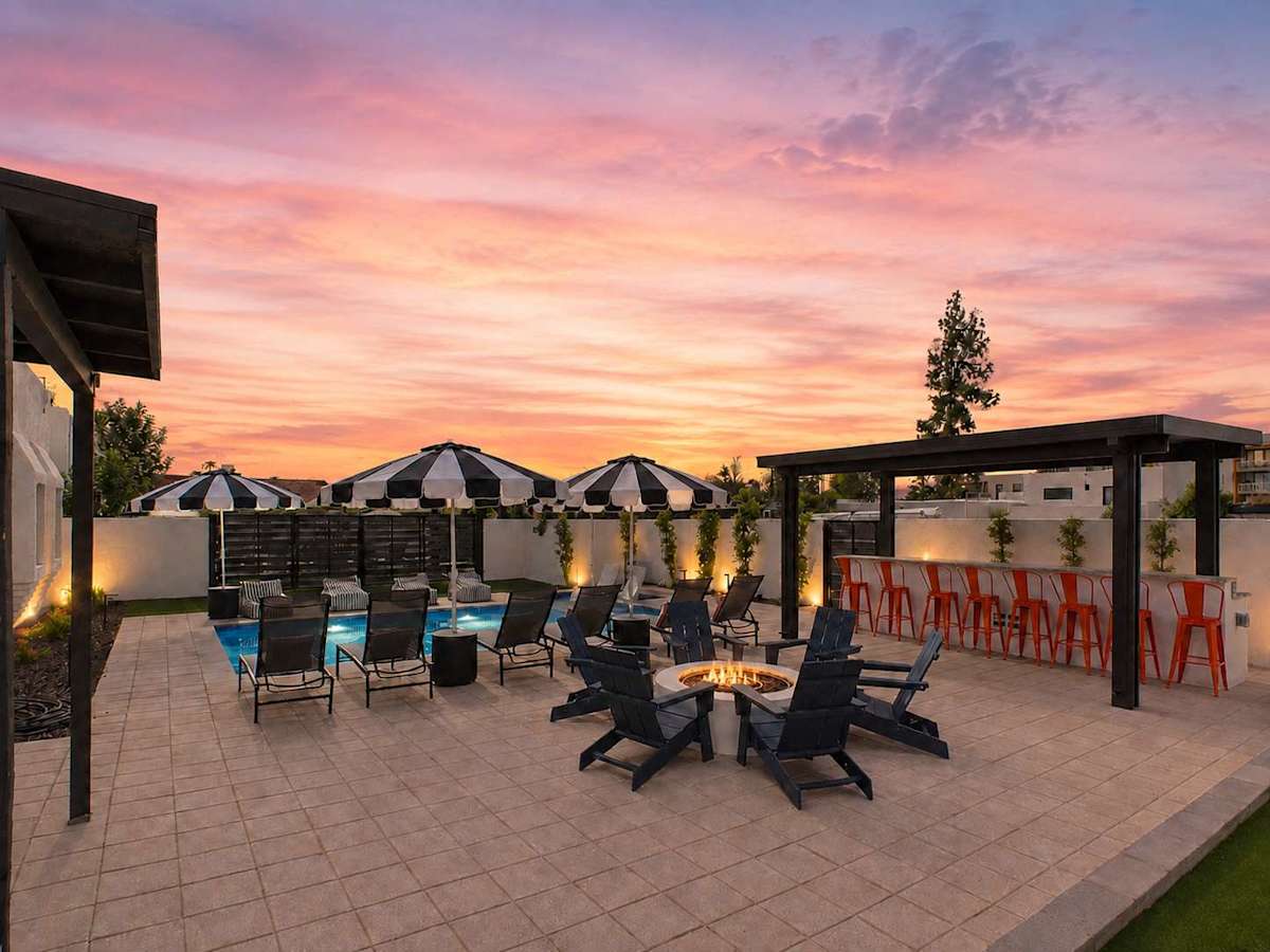 Unit 1: Incredible new $400K backyard just completed with a view of the Scottsdale Civic Center, a pool, fire pit, sun loungers, and BBQ grill with bar seating!