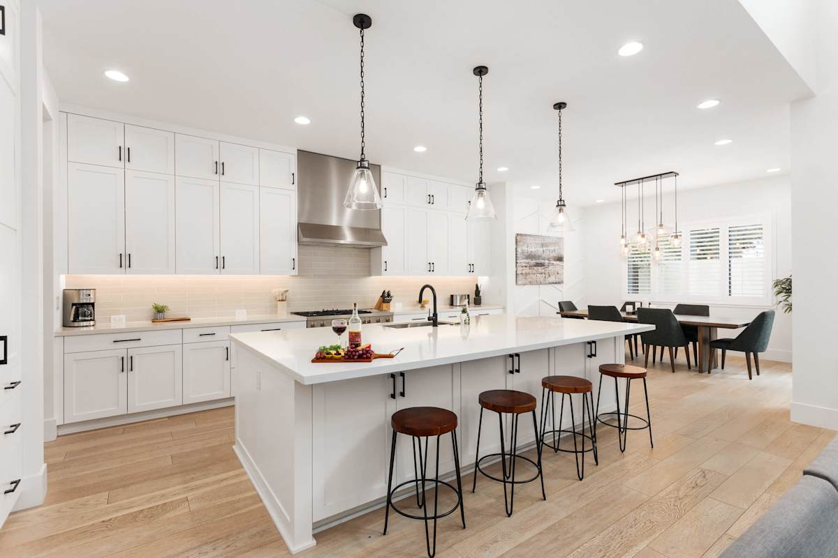 Fully equipped kitchen with stainless steal appliances and a kitchen island with bar seating for 4 guests.
