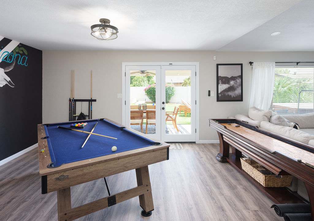 Pool table and shuffleboard in living room