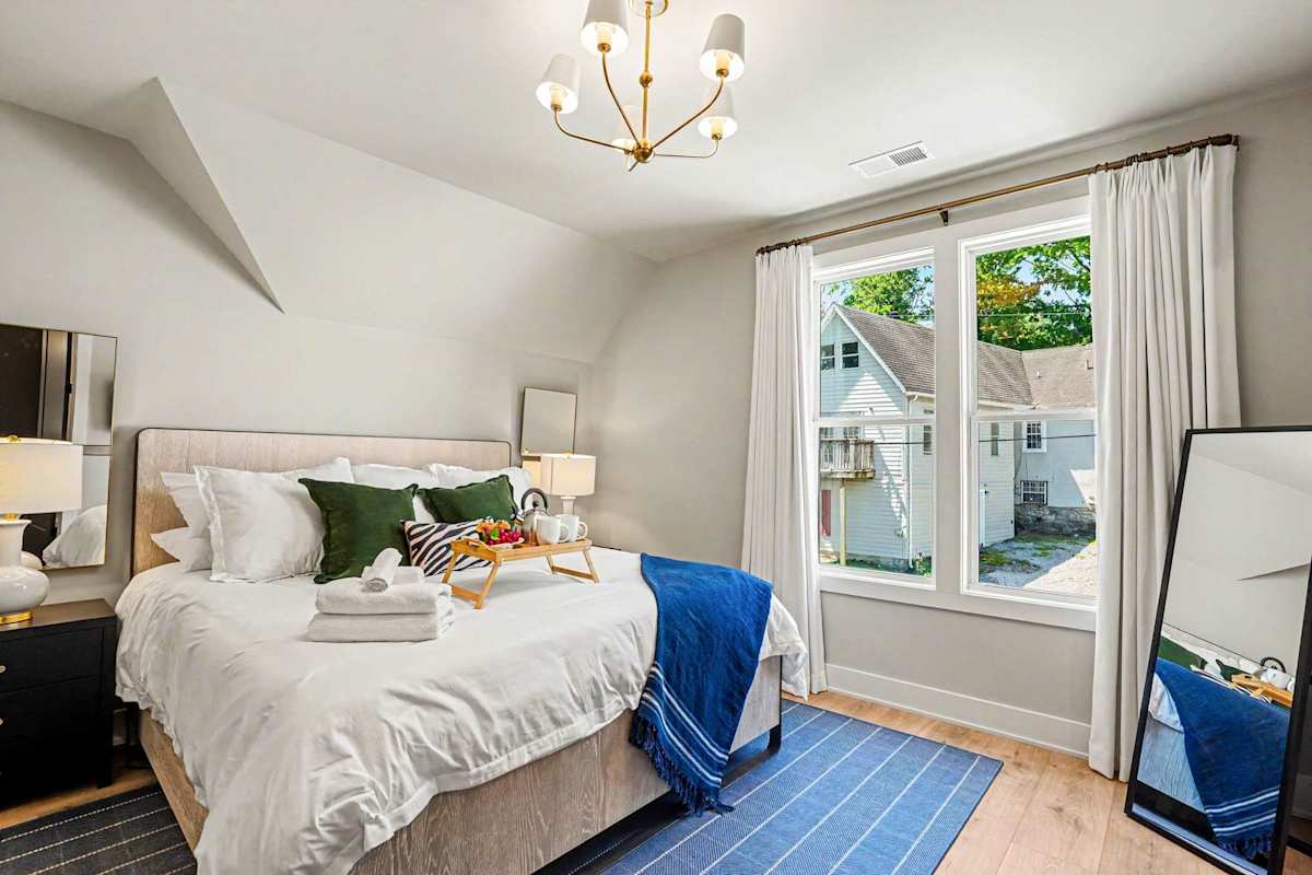 Primary Bedroom featuring a King bed, smart TV, walk-in closet, and an en-suite Jack-n-Jill bathroom.