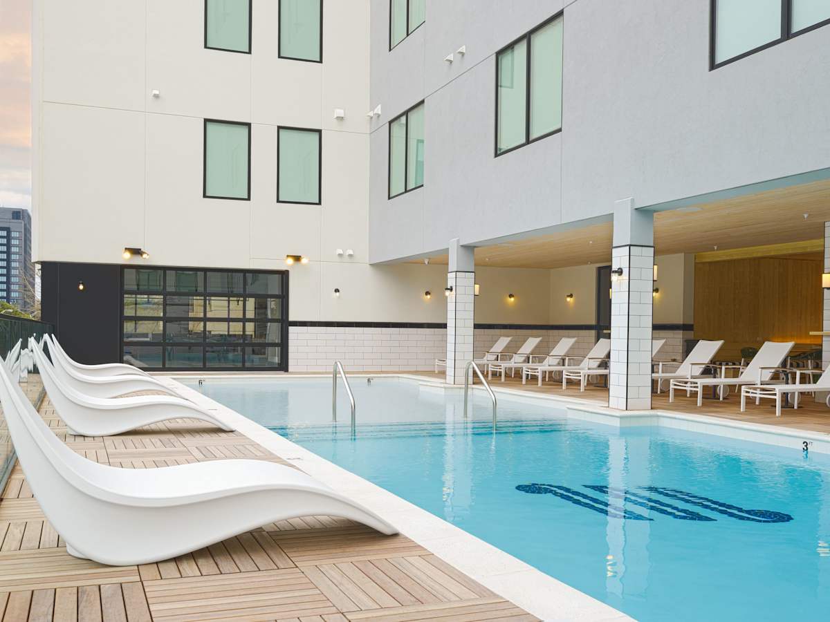 Communal Area: The Sparkling blue pool on the 3rd floor has city views and sun loungers.
