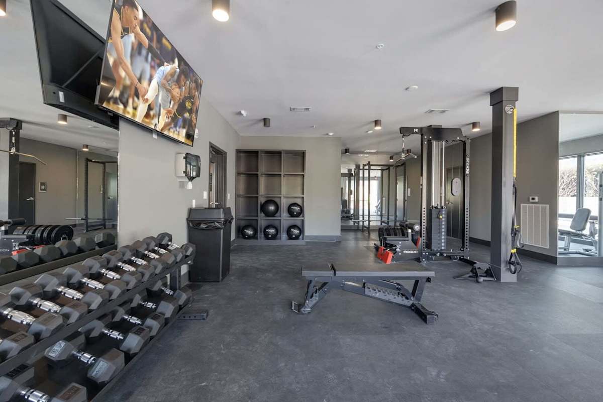 Communal Area: Gym offering a wide range of workout equipment, and a Smart TV.