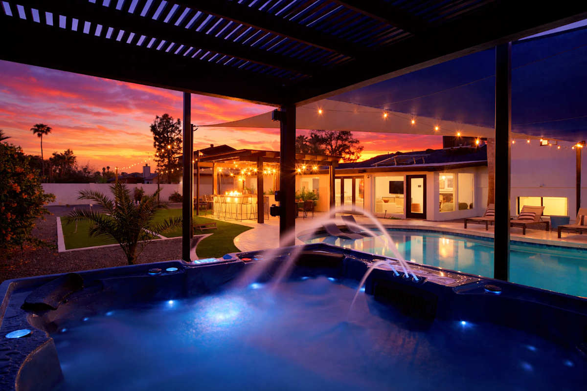 Relax in this Scottsdale oasis with a pool, hot tub, grill under bistro lights, putting green, chess, horseshoes, corn hole, fire pit, and outdoor dining for the perfect getaway.